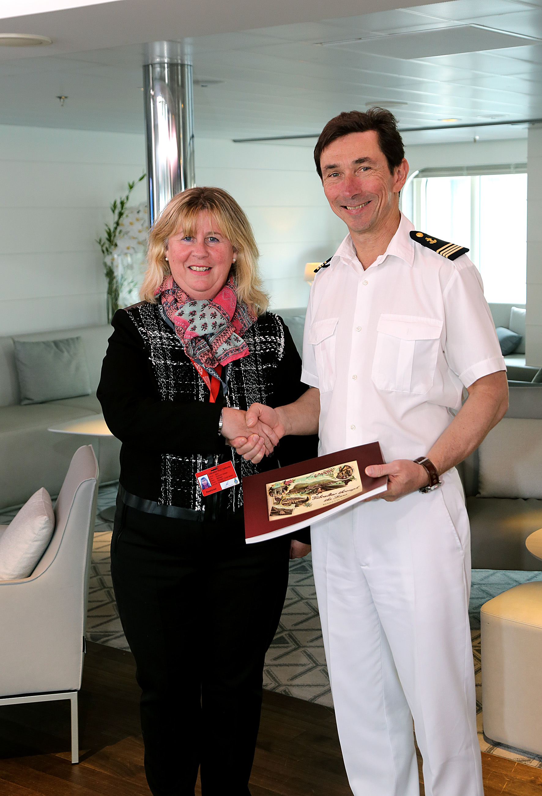 The GTB present Le Lyrial’s Captain with a book on Gibraltar for the ship’s library.
