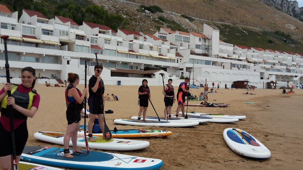 Youth club members take paddle boarding and pizza-making lessons
