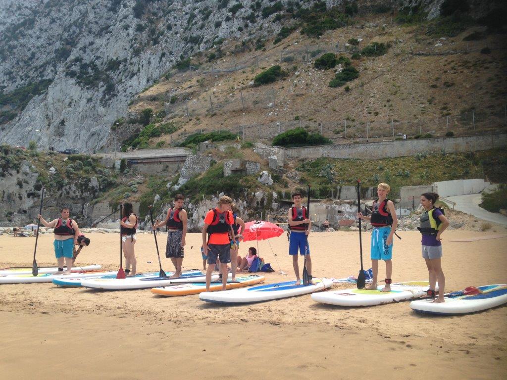 Youth club members take paddle boarding and pizza-making lessons