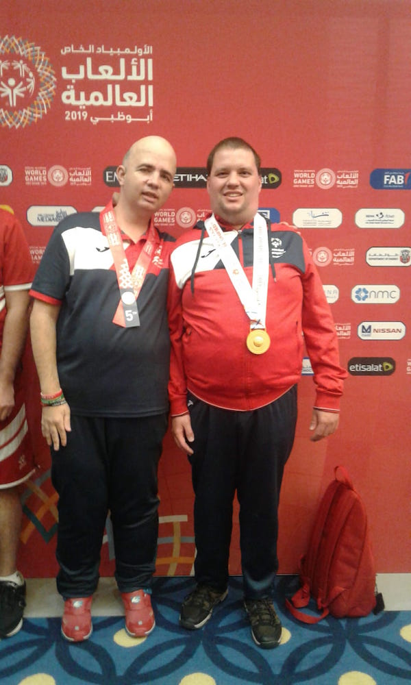 Gold medal winner Dorian Zammit with teammate Malcolm Miel and his 5th place ribbon